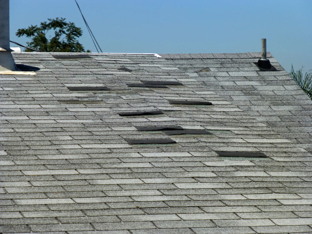 Wind-damaged roofing in Texas.
