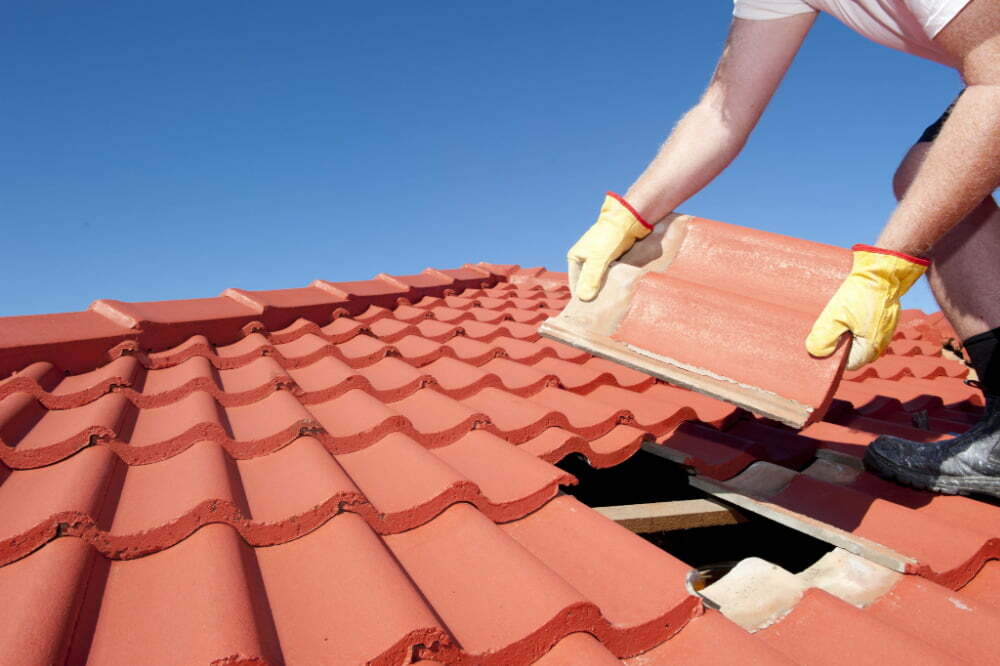 Damaged shingles are replaced by a roofing contractor to prevent further damage